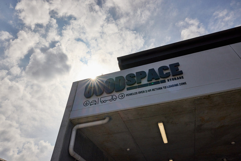 Goodspace signage on the Rouse Hill building exterior above the loading zone, against a bright sky