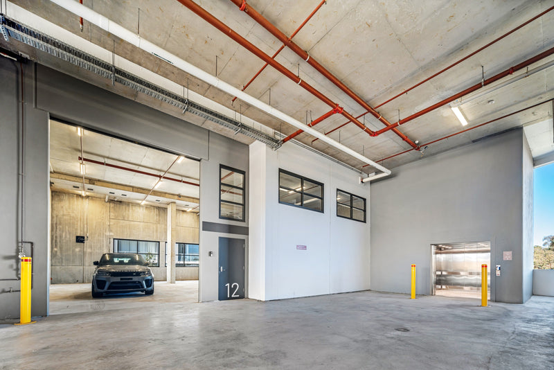 New warehouse at Goodspace Eastgardens with roller-door openings, safety bollards and polished concrete floor