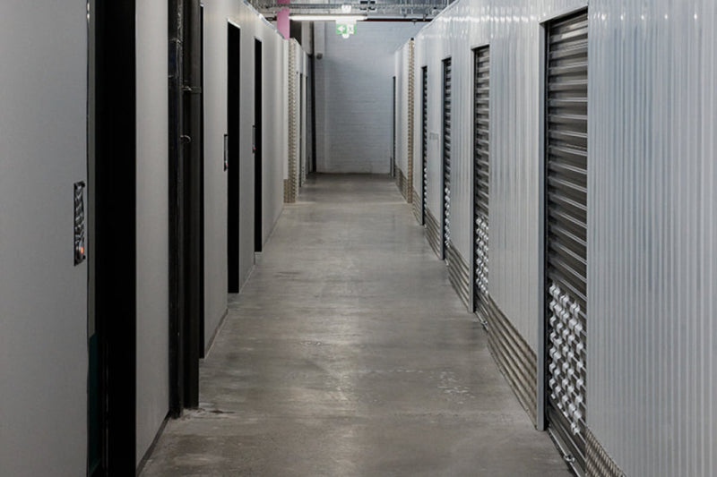 Indoor corridor of roller-door storage units at Goodspace Rouse Hill, each one opened by the Nokē app