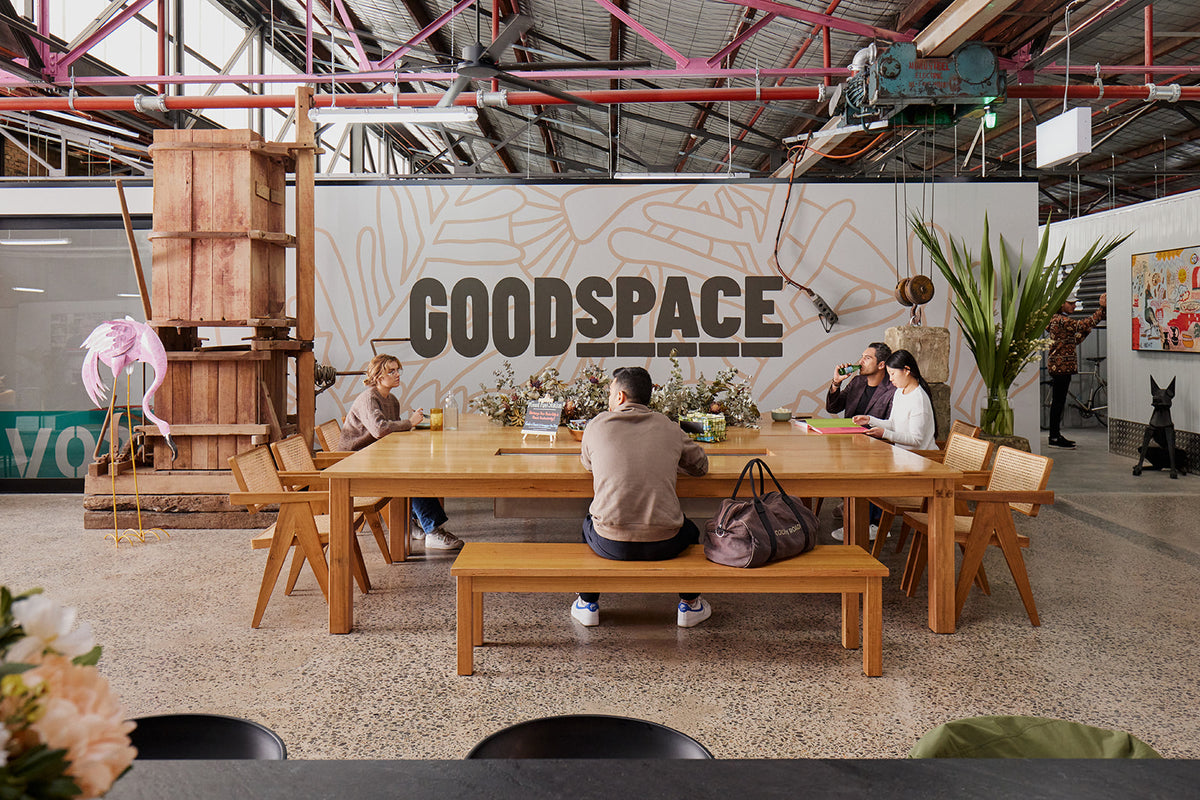 The communal table under the Goodspace mural at Kingsgrove