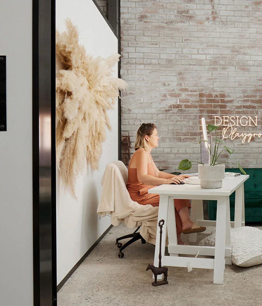 A desk against the brick wall at Goodspace Kingsgrove